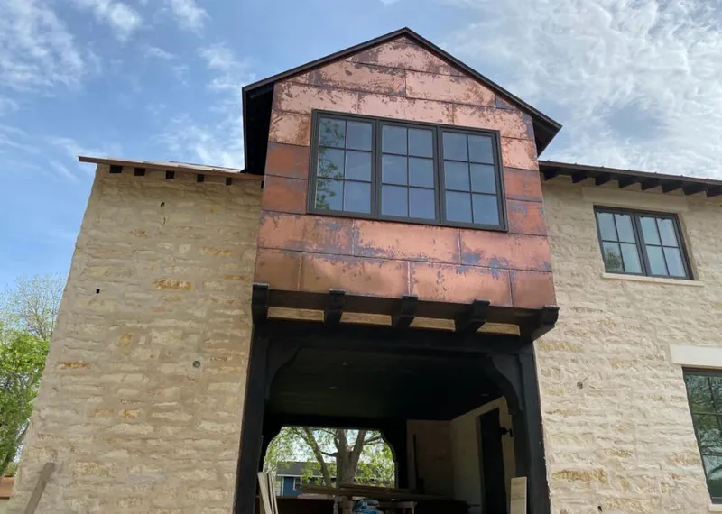 Copper metal panel facade on a stone building for Metal Roof Coating in Boiling Spring Lakes